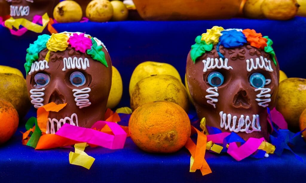 A group of skulls with decorations on them