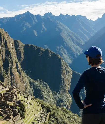Woman overlooks Macchu Picchu mountain in Peru