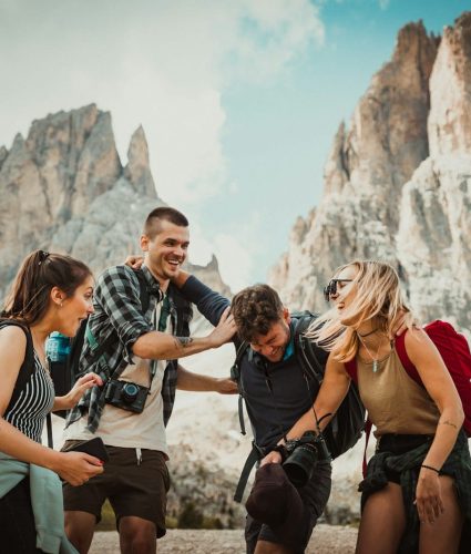 low-angle photography of two men playing beside two women